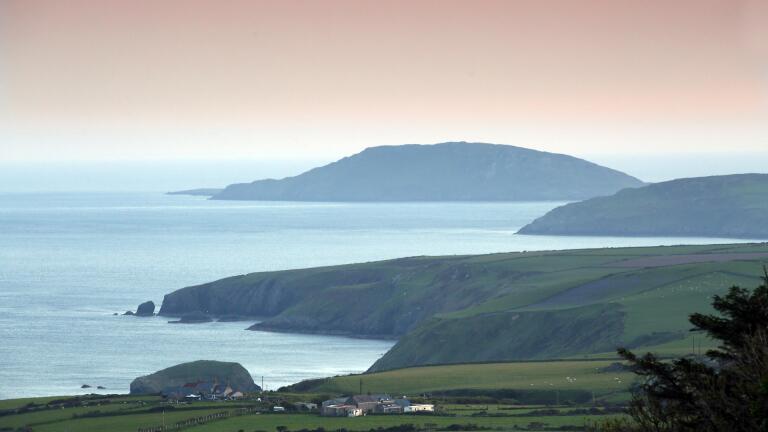 View of Bardsey Island from land.