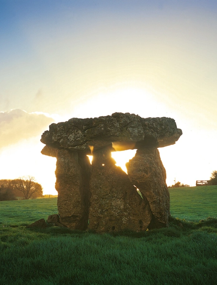 St Lythan's Burial Chamber standing stones with the sun shining through