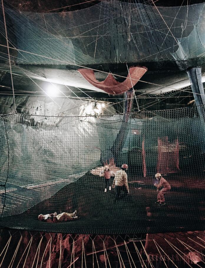 Family underground on trampolines in Bounce Below.