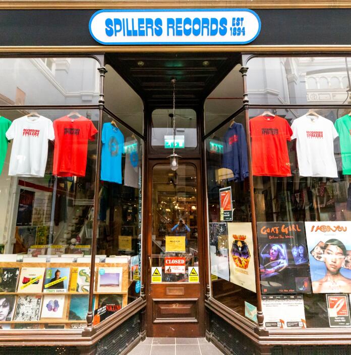 exterior of record shop with sign 'Spillers Records Est 1894'.