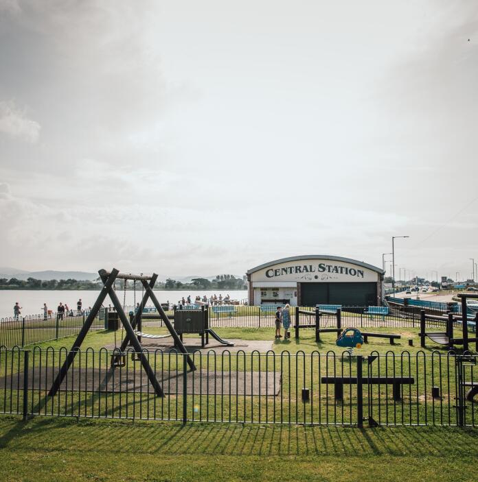 Rhyl Marine Lake Play Park showing a play park and the lake.