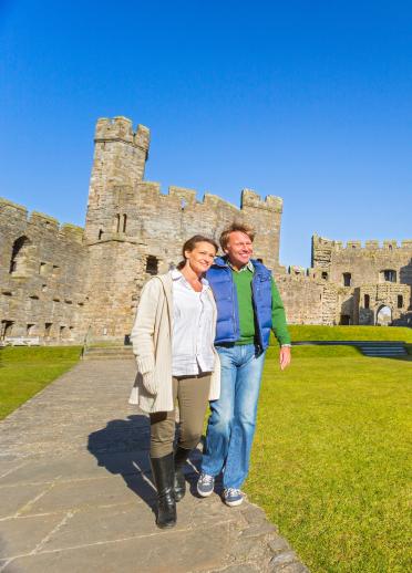 Couple walking in Caernarfon Castle, North Wales