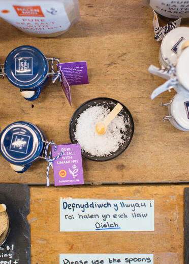 A table spread with different Halen Môn products.