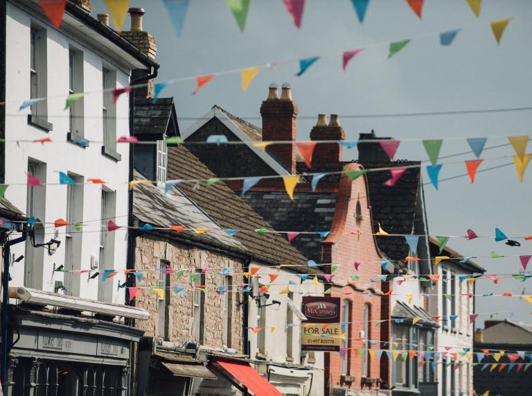 Image of colourful houses and shops with colourful bunting
