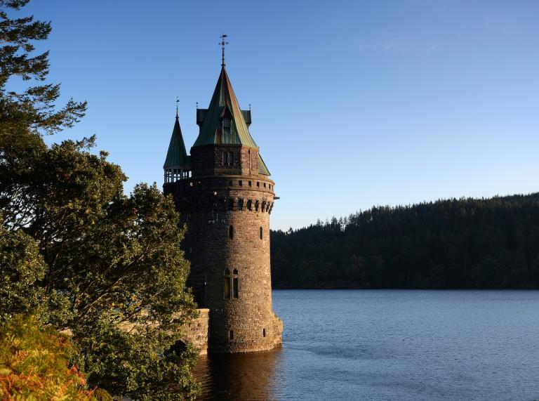 A fairytale style tower on a beautiful lake.