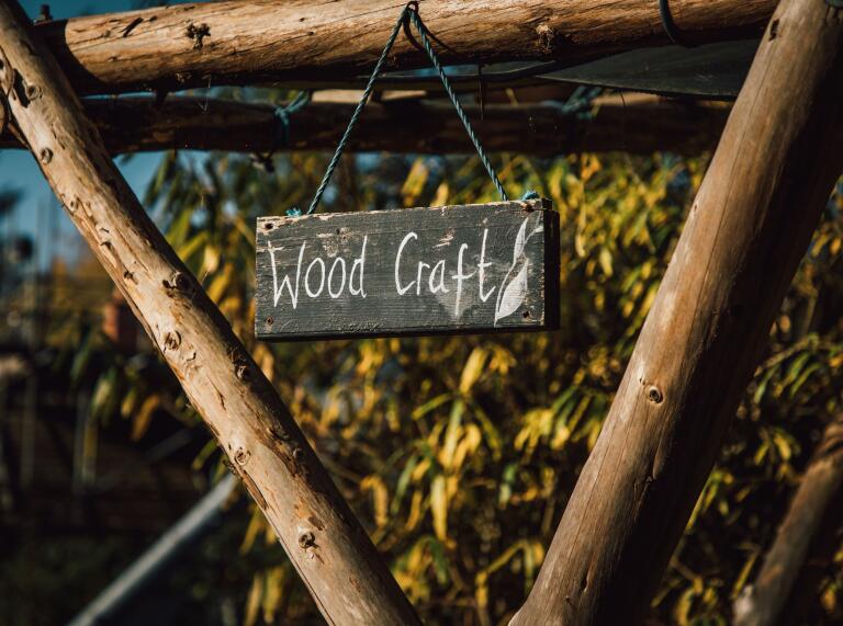 A sign saying wood craft.
