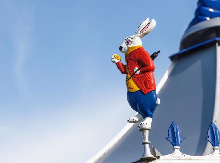 painted white rabbit on roof of building.