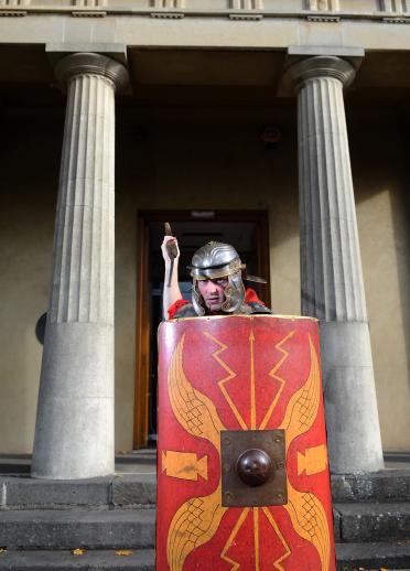 A Roman soldier with a shield and spear.
