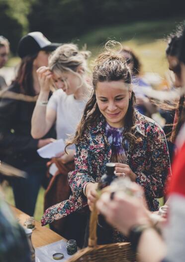 A group of smiling womxn at a festival