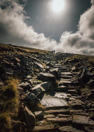 Steep stone steps up a mountainside.