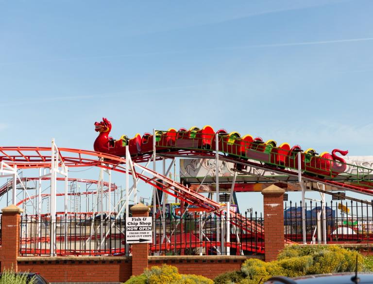 A small red dragon shaped rollercoaster ride at Barry Island Pleasure Park