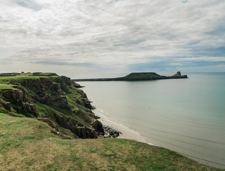 A high cliff above a beach.