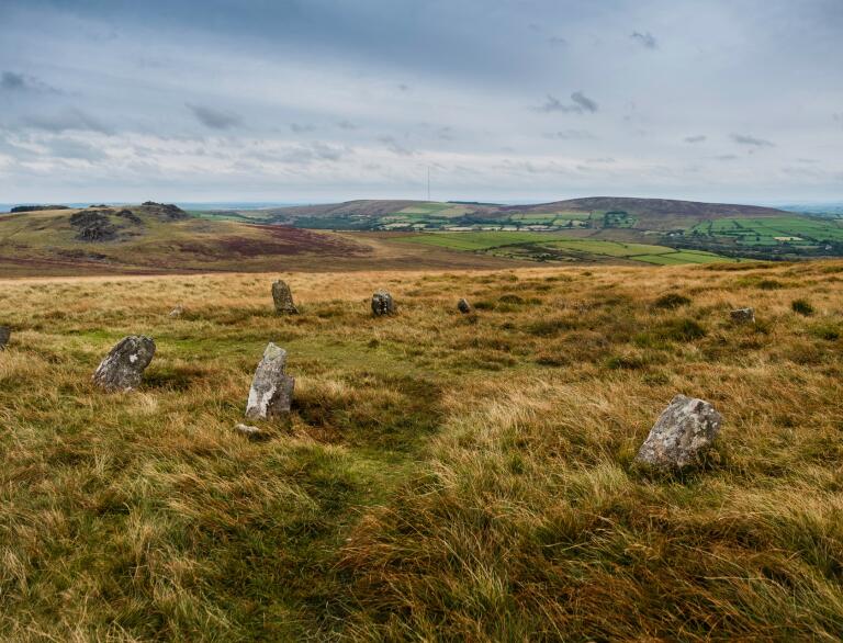 A collection of Neolithic stones on the Preseli Hills, looking over to Carn Menyn peak.