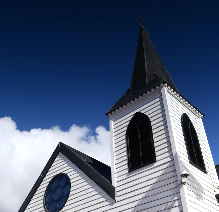 Close up image of the roof and steeple of the Norwegian Church