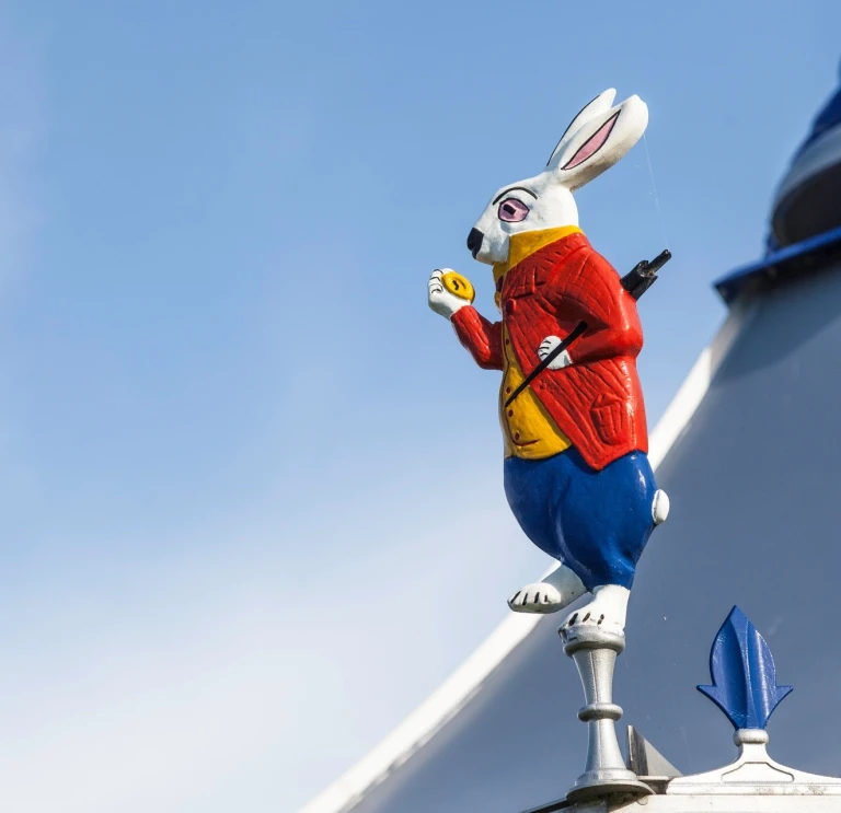 painted white rabbit on roof of building.