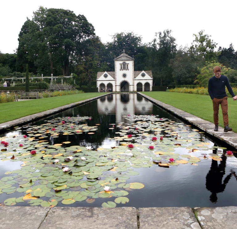 Couple walking in Bodnant Garden, Conwy