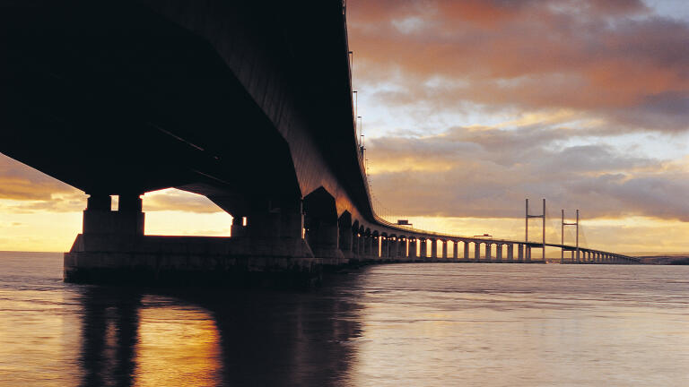 The Prince Wales Bridge crossing the river Severn with the sun going down.