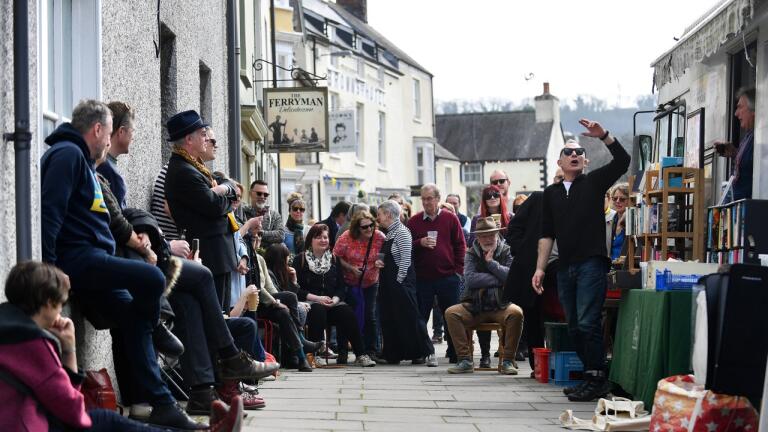 Performers in the street at Laugharne.