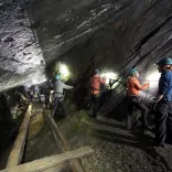 Teams traverse on of the underground bridges at Go Below Xtreme experience.