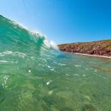 Wave crashing onto a Pembrokeshire beach.