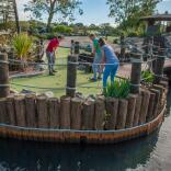  family playing adventure golf.